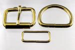 Two 1 1/2 inch brass plated roller buckles, two belt keepers, and two D rings